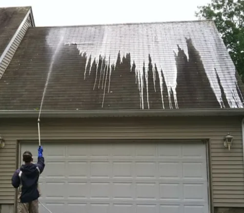 Roof soft wash in progress