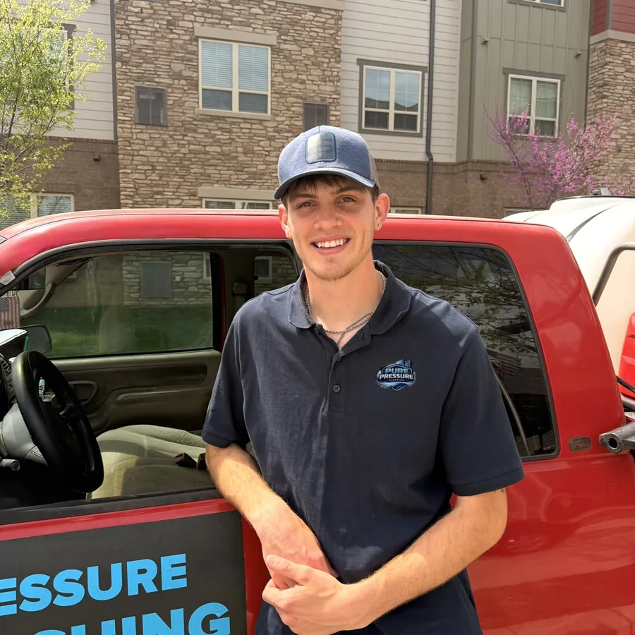 Drake Parkinson, owner of Pure Pressure Cleaning, at his truck.